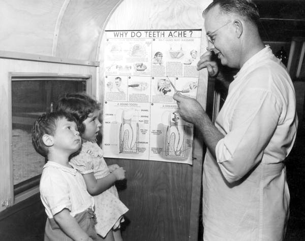 Dr. Drew H. Turner explains a tooth to David and Pamela King - Mayport, Florida