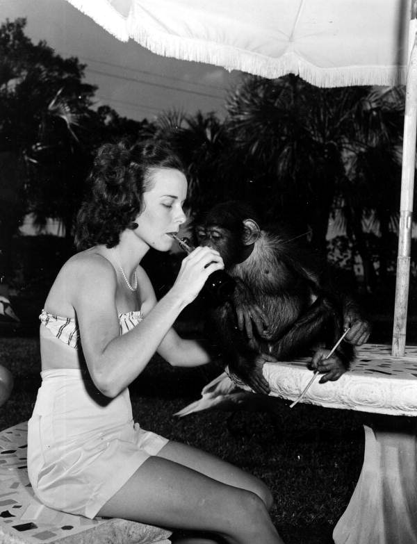 Frances Freeman enjoys soft drink while Joe watches - Kendall, Florida