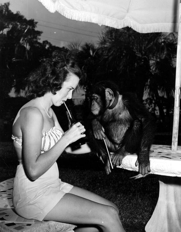 Frances Freeman enjoys soft drink while Joe watches - Kendall, Florida