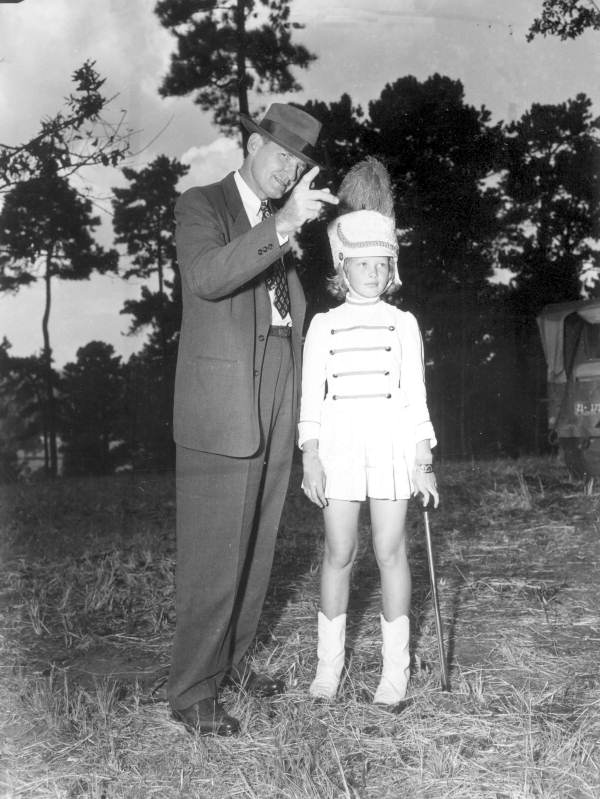 Governor Millard Caldwell speaks to a young drum majorette - Chattahoochee, Florida