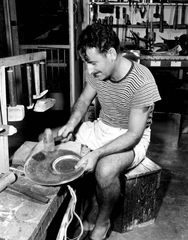 Cyril Marshall hammers a metal tray - Key West, Florida