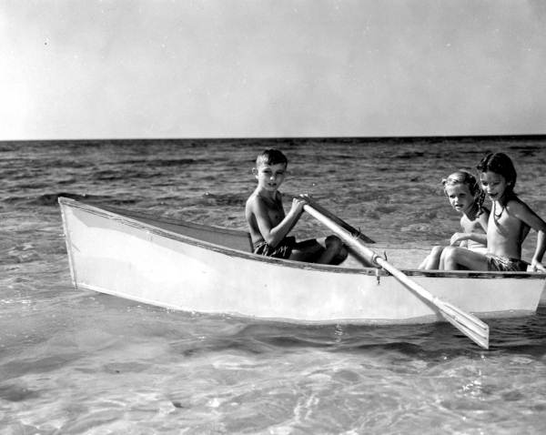 Children in a small boat at the Sunny Hours Beach School - Saint Petersburg, Florida.