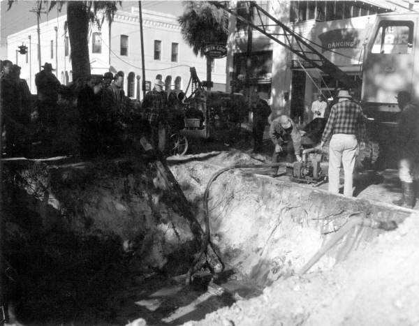 Crowd of spectators surrounding an excavation - Green Cove Springs, Florida