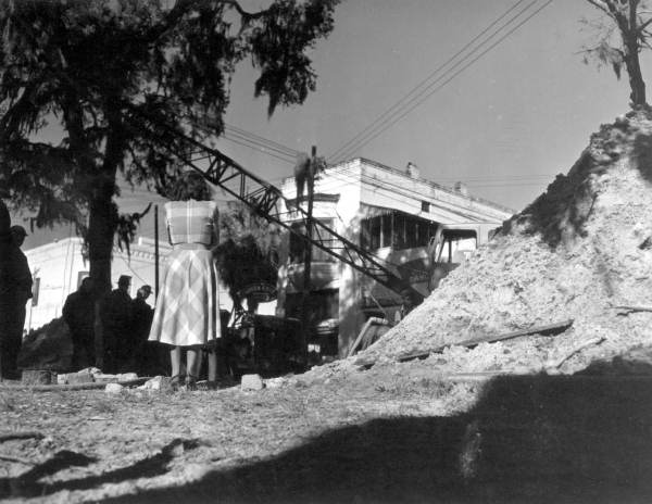 Crowd of spectators surrounding an excavation - Green Cove Springs, Florida