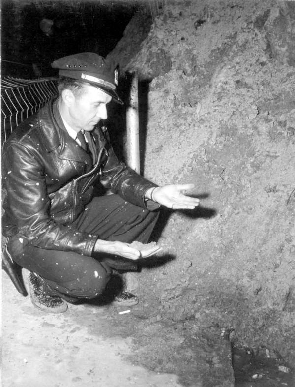 Officer Leo Davis sifts through gold fragments - Green Cove Springs, Florida