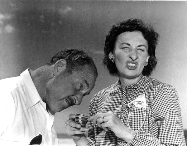 Elnora Metzel and husband Truman T. Metzel smelling a shell - Sanibel Island, Florida.