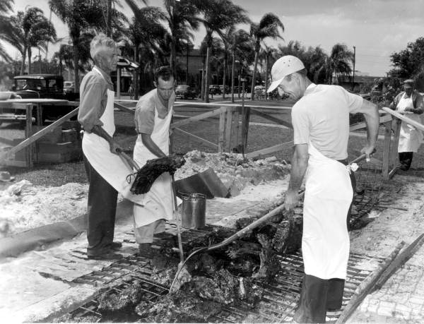 Harry McGruder, Claude Yates and John Bridges tend the barbecue pit - Kissimmee, Florida