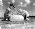 Roy Carlton and Artie Key testing a 73 pound watermelon at the Florida Watermelon Festival - Leesburg, Florida