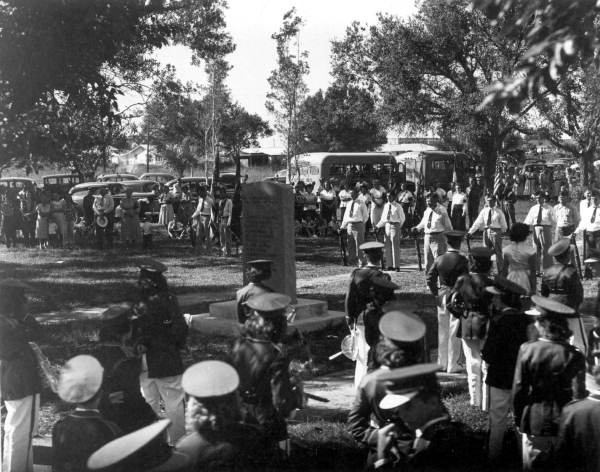 Crowd pauses during Armistice Day celebration - Okeechobee, Florida