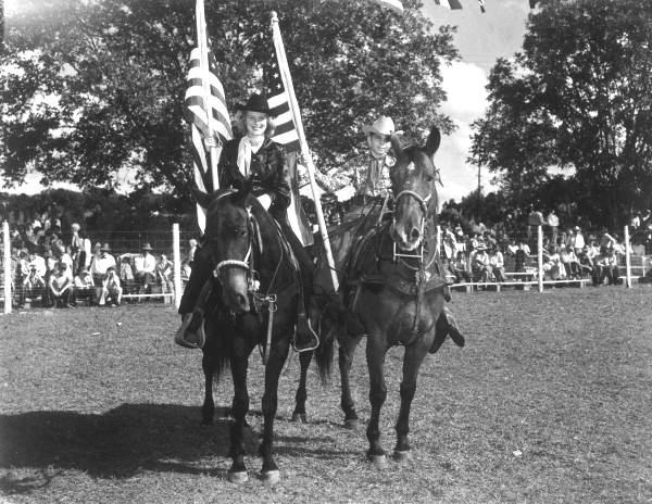 Two riders hold the American flag - Bonifay, Florida