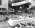 Young women on the Leesburg automobile dealers association float in the parade at the watermelon festival - Leesburg, Florida