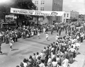 Crowd watching marching band in the parade at the watermelon festival - Leesburg, Florida