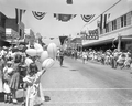 Crowd watching marching band in the parade at the watermelon festival - Leesburg, Florida