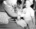 Young boy and clown at the watermelon eating contest in the watermelon festival - Leesburg, Florida