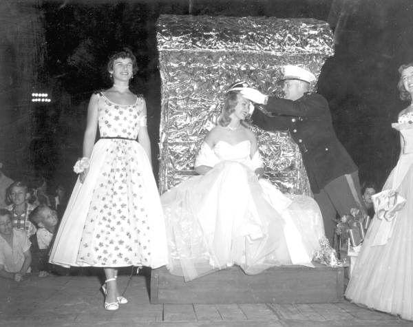 Beauty contestant being crowned by a Marine Corps officer at the watermelon festival - Leesburg, Florida