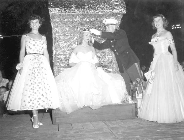 Beauty contestant being crowned by a Marine Corps officer at the watermelon festival - Leesburg, Florida