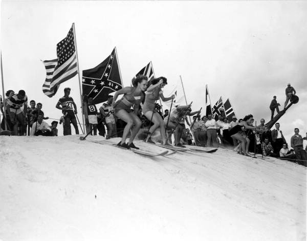 Young women skiing down the hill of sand - Fort Meade, Florida .