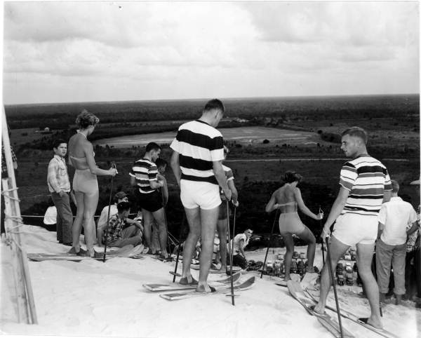 Skiers wait their turn on the mountain of sand - Fort Meade, Florida .
