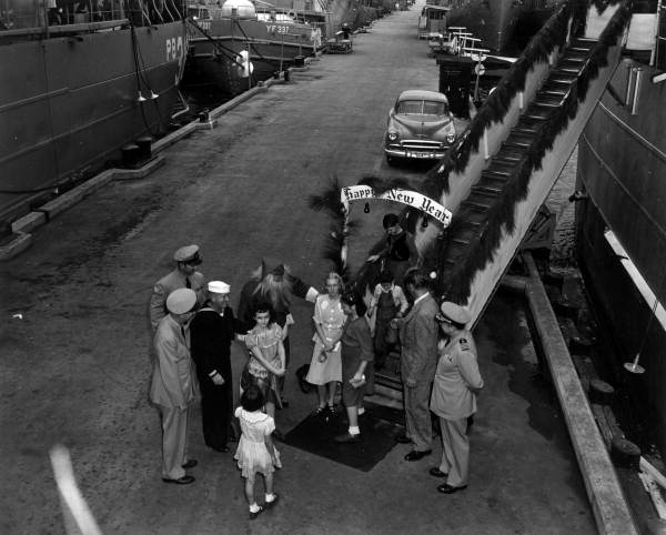 Passengers leaving ship for the premiere of "Distant Drums" in Saint Augustine, Florida.