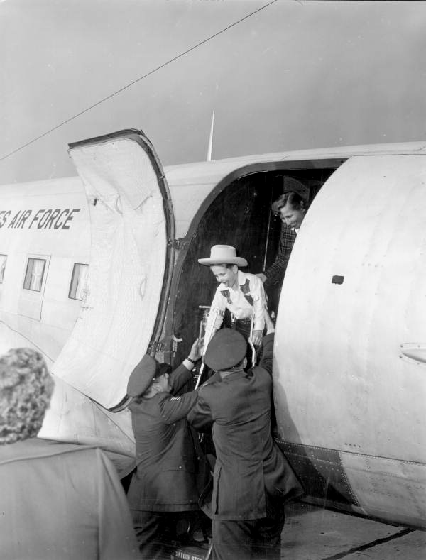 Larry Gross is assisted off the plane
