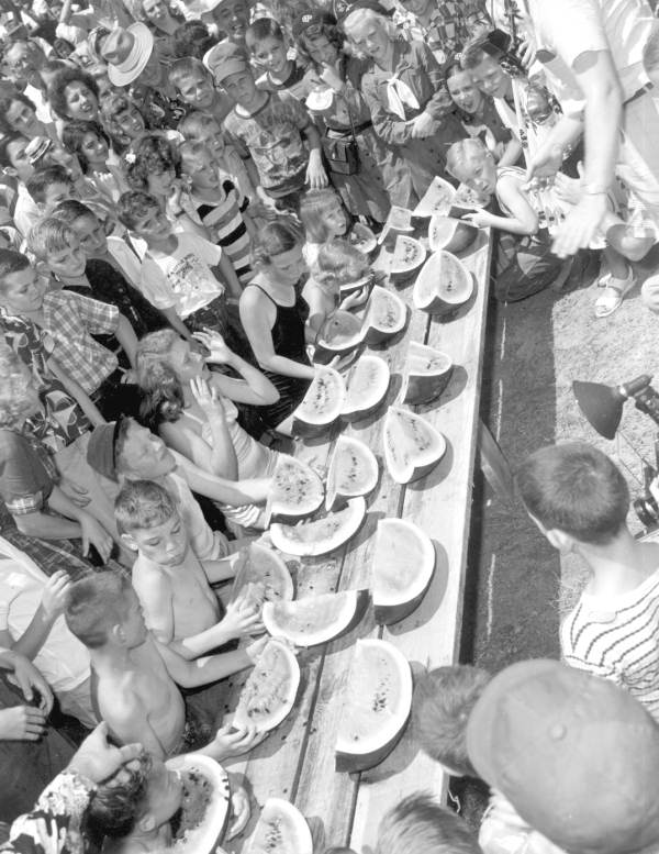 Children participating in a watermelon eating contest at the watermelon festival - Leesburg, Florida