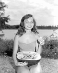 Carolyn Vaughn enjoying a slice of watermelon at the watermelon festival - Leesburg, Florida