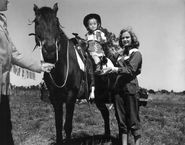 Deborah Ann Wilcox and Patricia J. Poland with a horse - New Smyrna Beach, Florida .