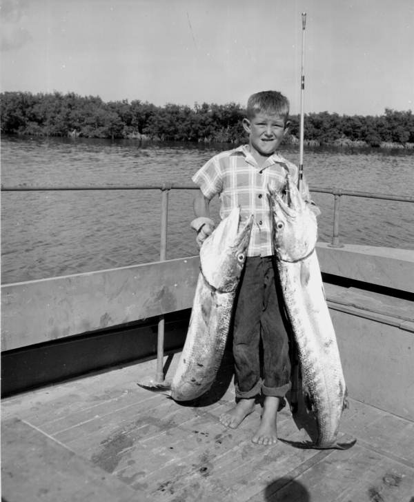 Eight year old Marvin Hendry displaying two freshly caught barracudas - Marathon, Florida