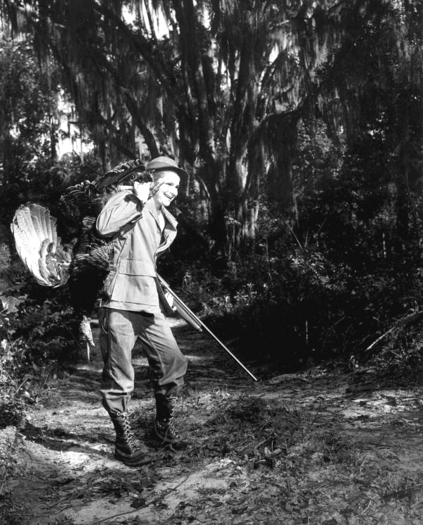 Mike Oxenberg happily carrying a killed turkey - Tallahassee, Florida.