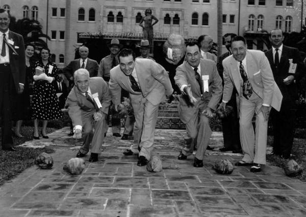 Governors playfully rolling coconuts at the Governors' Conference - Boca Raton, Florida.