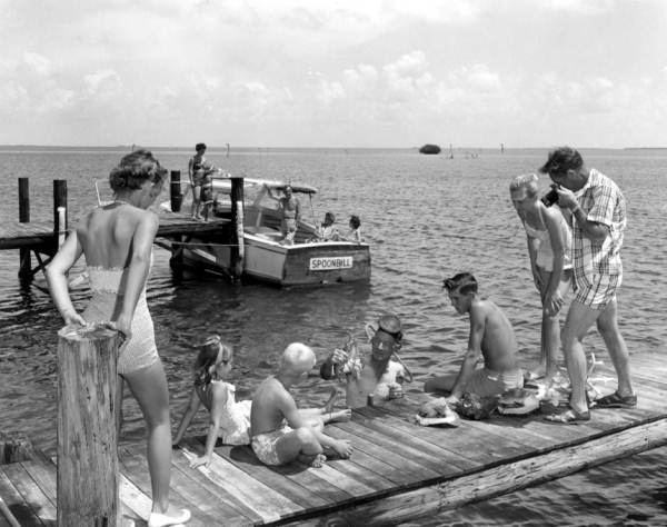 Herb Alley dives for Florida lobster and shells for the amusement of his guests - Tavernier, Florida.