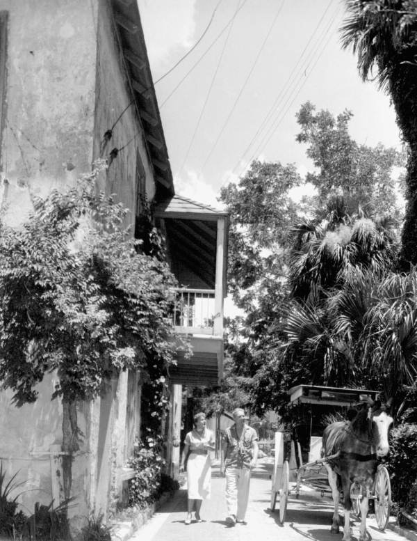 Couple walking down Aviles Street - Saint Augustine, Florida