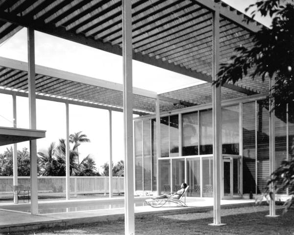 Woman sunbathing on the patio at the Sommers "slat" home - Sarasota, Florida