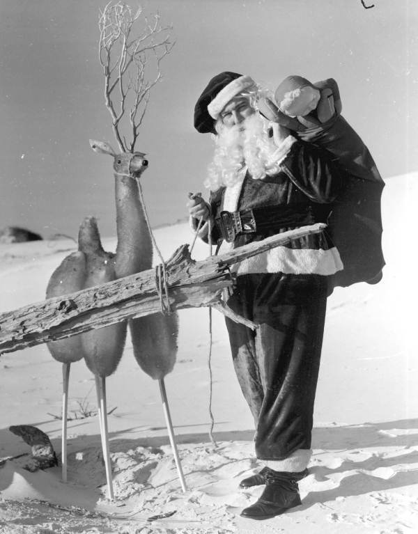 Santa Claus with reindeer at the beach - Panama City Beach, Florida.