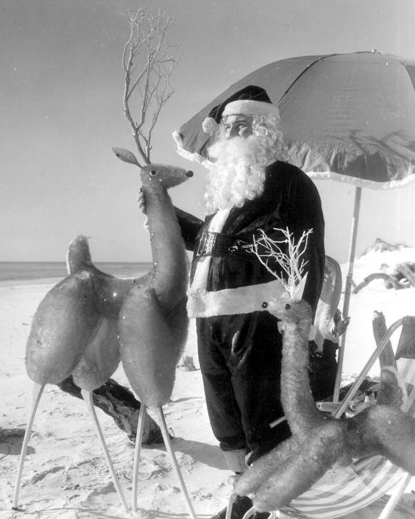 Santa on beach with reindeers - Panama City Beach, Florida.