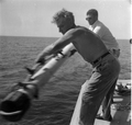 Fred Logan and Art McKee move the equipment over the wreck of Capitana- Plantation Key, Florida .