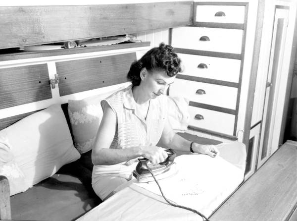 Woman ironing aboard a houseboat in Fort Lauderdale