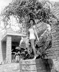 Jackie Sweeting poses with anchor on display at McKee's Museum of Sunken Treasure - Plantation Key, Florida