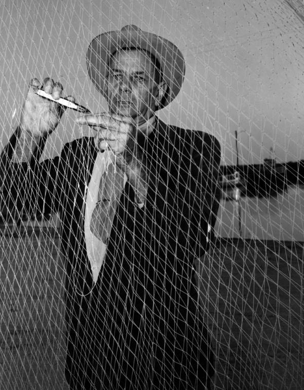 H. O. Marshall mending his fishing net - Apalachicola, Florida.