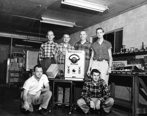 Employees standing for a group portrait at the Electron-Machine Corporation - Umatilla, Florida.
