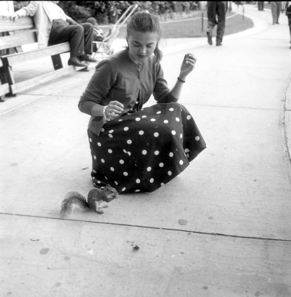 Keity Klynne feeds a squirrel - Polk County, Florida .