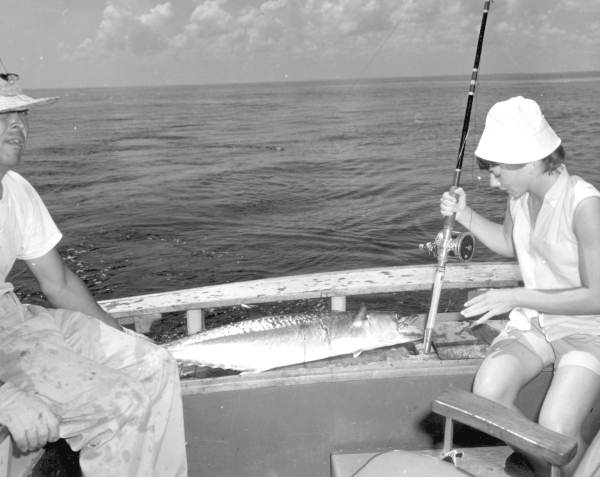 Woman in a boat looking at the kingfish catch - Stuart, Florida.