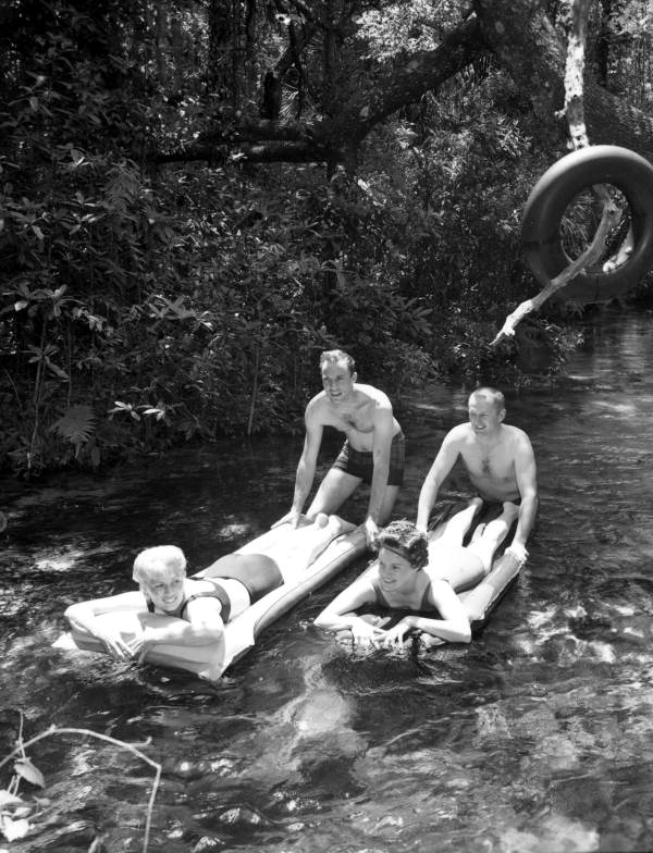 Unidentified men and women on floats in the river - Ocala, Florida .