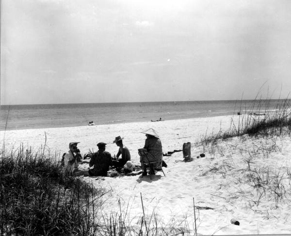 People relax on the beach.