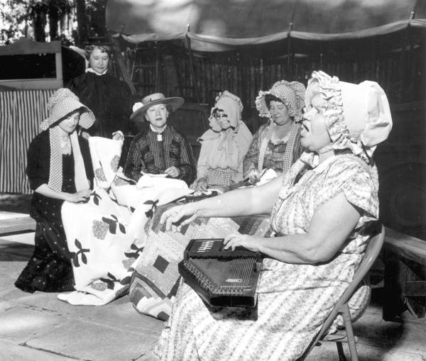Mount Pleasant Home Demonstration Club members knitting quilts at the Florida Folk Festival