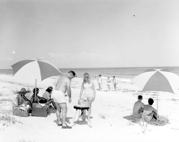 Family picnicking on the beach - Saint George Island, Florida.