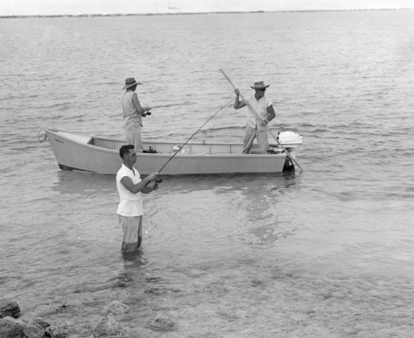 Two fishermen fishing near the shore during the World Series of Sport Fishing - Marathon, Florida