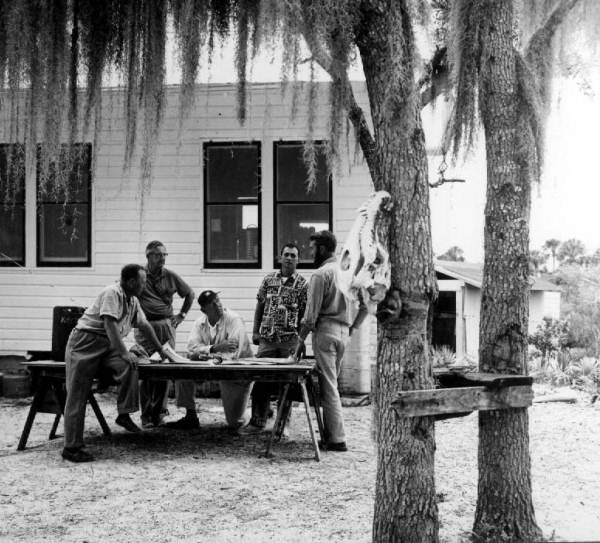 Men discussing the Little Manatee River boating trip