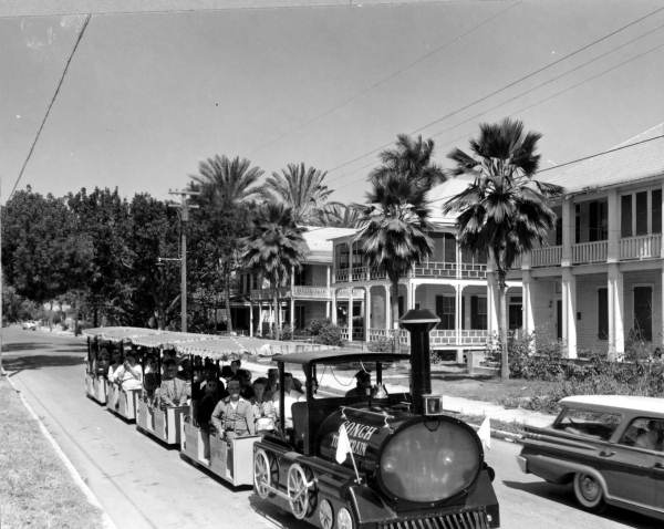 Conch tour train passing through a residential area - Key West, Florida.