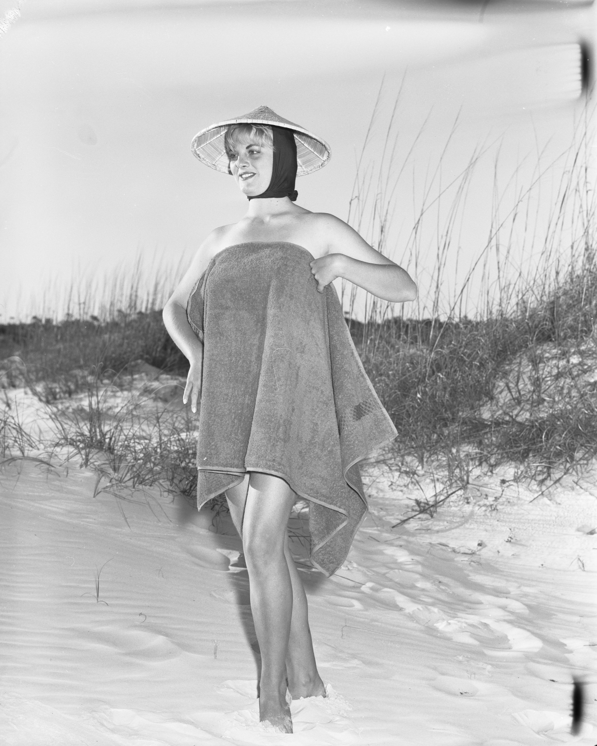 Penny Buzzard wraps herself in a towel at Saint Andrews State Park